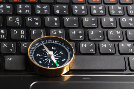 compass on computer keyboard, business decisionの写真素材
