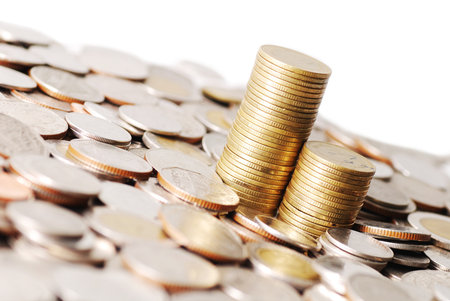 two row stack of coins on many coins backgroundの写真素材