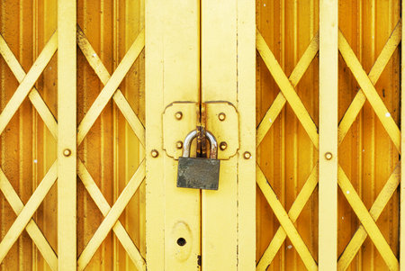 lock on yellow steel doorの写真素材