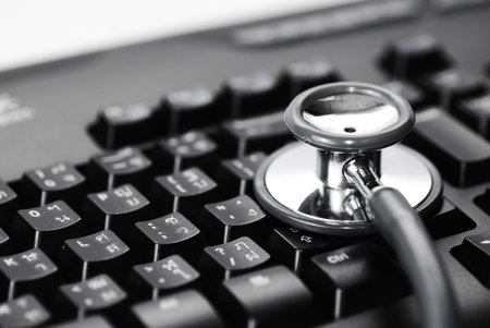 Stethoscope on keyboard background