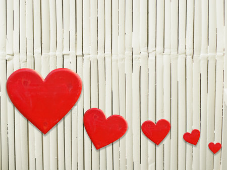 Five hearts on white bamboo mat as striped background texture patternの写真素材