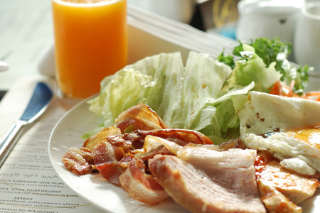Traditional breakfast with bacon and fried eggsの写真素材