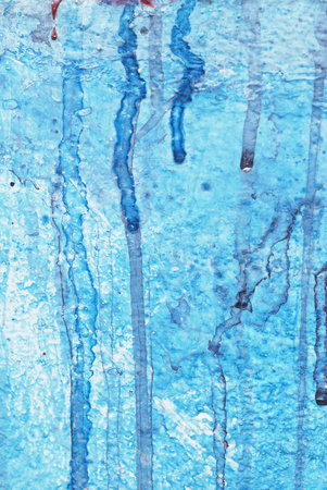 Blue watercolor stain on the wall