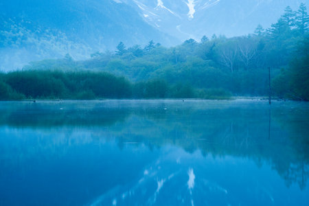 Early morning at spring Kamikochi Taisho-ike pond,nagano,japanの写真素材