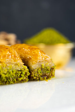 Pistachio baklava on white marble. Traditional middle eastern dessert. Turkish Antep baklava.の写真素材