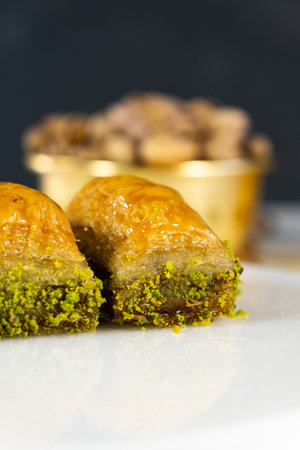 Pistachio baklava on white marble. Traditional middle eastern dessert. Turkish Antep baklava.の写真素材