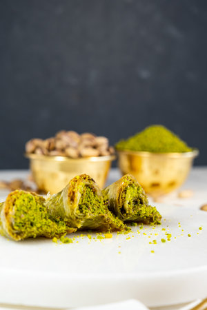 Pistachio baklava on white marble. Traditional middle eastern dessert. Turkish Antep baklava.の写真素材