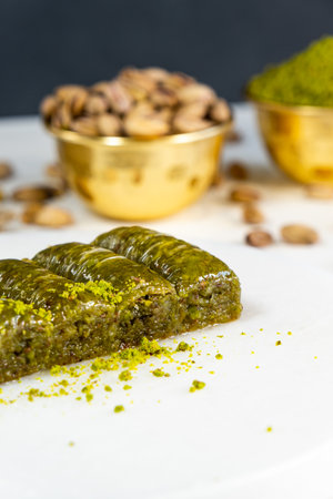Pistachio baklava on white marble. Traditional middle eastern dessert. Turkish Antep baklava.の写真素材