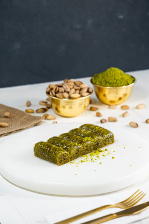 Pistachio baklava on white marble. Traditional middle eastern dessert. Turkish Antep baklava.の写真素材