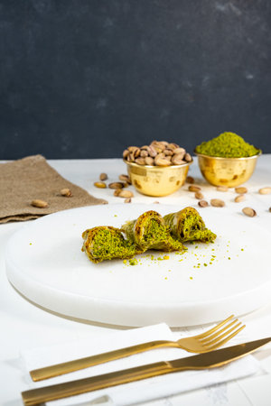 Pistachio baklava on white marble. Traditional middle eastern dessert. Turkish Antep baklava.の写真素材