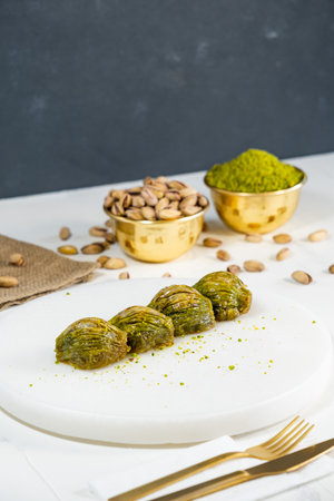 Pistachio baklava on white marble. Traditional middle eastern dessert. Turkish Antep baklava.の写真素材