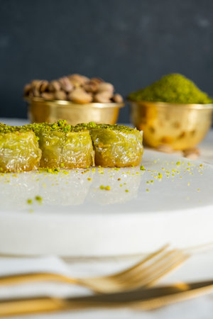 Pistachio baklava on white marble. Traditional middle eastern dessert. Turkish Antep baklava.の写真素材