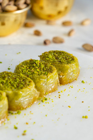 Pistachio baklava on white marble. Traditional middle eastern dessert. Turkish Antep baklava.の写真素材
