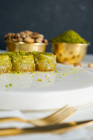 Pistachio baklava on white marble. Traditional middle eastern dessert. Turkish Antep baklava.の写真素材