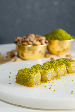 Pistachio baklava on white marble. Traditional middle eastern dessert. Turkish Antep baklava.の写真素材