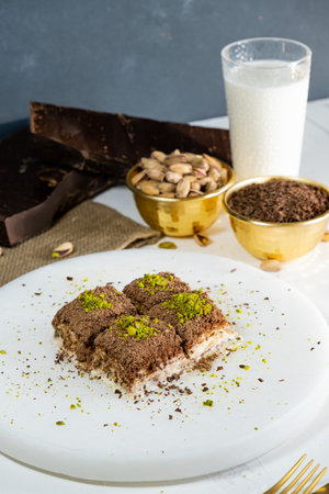 Pistachio cold baklava on white marble. Traditional middle eastern dessert. Turkish Antep baklava.の写真素材