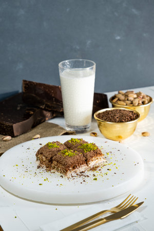 Pistachio cold baklava on white marble. Traditional middle eastern dessert. Turkish Antep baklava.の写真素材