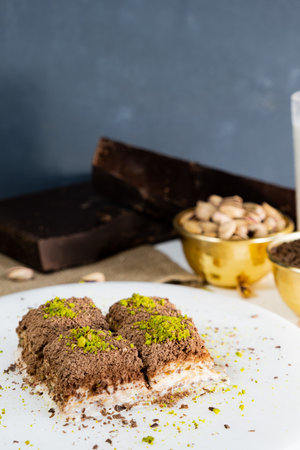 Pistachio cold baklava on white marble. Traditional middle eastern dessert. Turkish Antep baklava.の写真素材