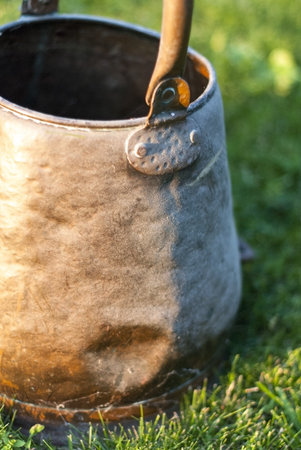 Metal Bucket On Grassの写真素材
