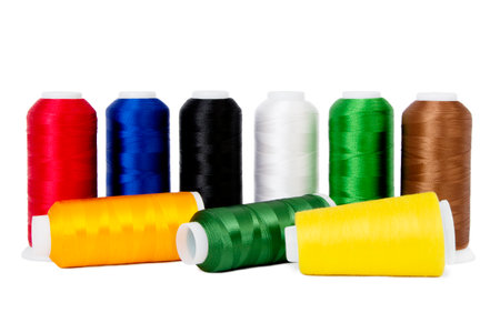 Multiple Reels of Floss Sewing Thread in Various Colours Grouped Together, Isolated on White Backgroundの写真素材