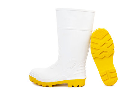 White Gumboots with Yellow Soles Isolated on White Backgroundの写真素材