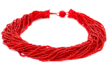 Red, Beaded, Handmade African Necklace Isolated on Whiteの写真素材