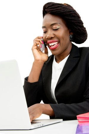 Attractive Woman Speaking on the Phone, Working on the Laptop, Isolated on White Backgroundの写真素材