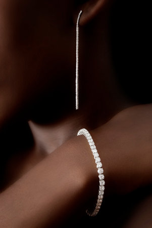 Diamonds Earring and Bracelet on Black Skin, Designer Jewelleryの写真素材
