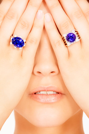 Closeup of a Model Wearing two Tanzanite Designer Rings, Isolated on Whiteの写真素材