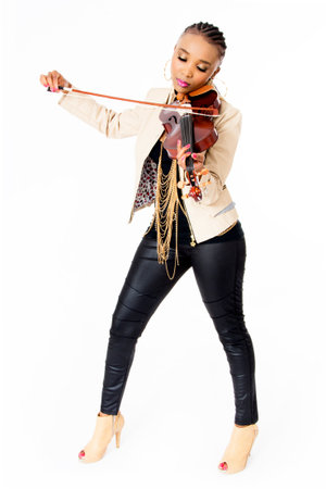 Young Beautiful African Woman Playing the Violin, Fashion, Full Length, Studio Shot, Isolated on Whiteの写真素材