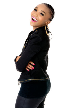 Young Beautiful African Woman Wearing a Black Jacket Golden Jewellery and Pink Lips, Fashion, Studio Shot, Isolated on White Backgroundの写真素材