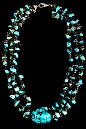 Necklace with Turquoise and Black Stones, on Black Backgroundの写真素材