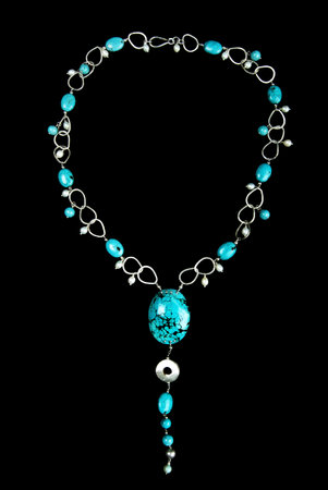 Necklace with Turquoise Stones, Pearls and Silver, on Black Backgroundの写真素材