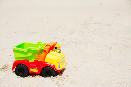 Background - Toy Truck in the Sand on a Sunny Summer Dayの写真素材