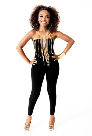 Full-length Photo of Beautiful African Female Model, Big Smile, Afro Hairstyle, Wearing Tight Black Clothes, and Golden Jewellery, Isolated on White Backgroundの写真素材