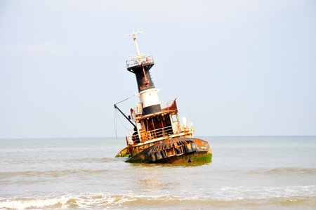 Rusted Shipwreck on the Beach since 1975 at the 'ship graveyard' of Barro Do Dande, Angola, Southern Africaの写真素材