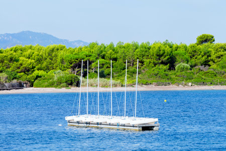 Small sailing boats on a sea platform close to shore, beach .の写真素材