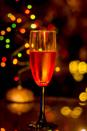 Wine glass with christmas backgroundの写真素材