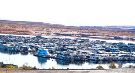 Hundreds of boats docked in the lake with a view of the mountainsの写真素材