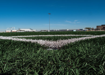 A white chalk outline at the corner of a football fieldの写真素材