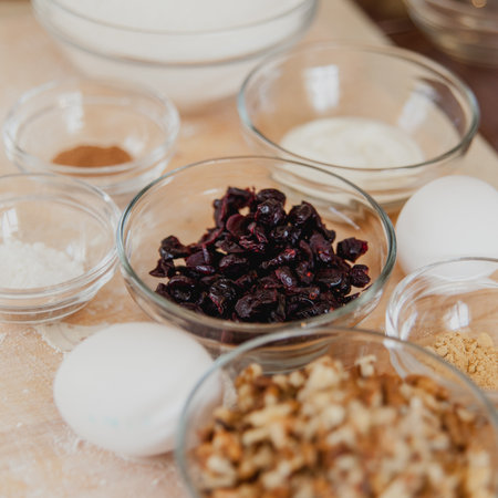 Baking ingredients on kitchen table. Products for filling cupcakes prepare for cooking on wooden cutting board. Lifestile food concept.の写真素材