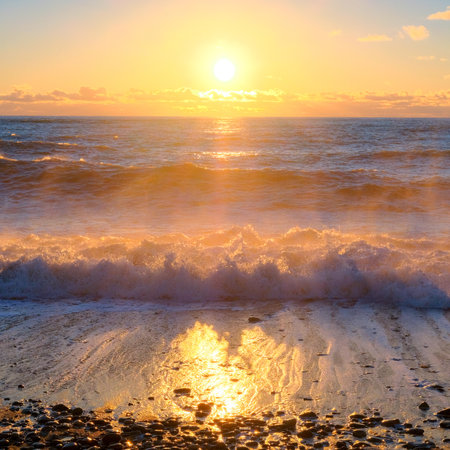 Yellow sun lights big storm waves. Sunset on the sea. Beautiful nature.