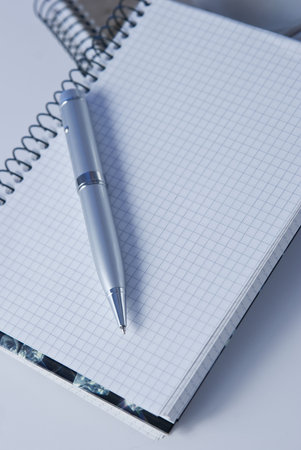 modern and luxury silver pen and notebook isolatedの写真素材