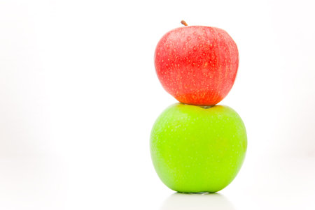 green and red aplles isolated over white backgroundの写真素材