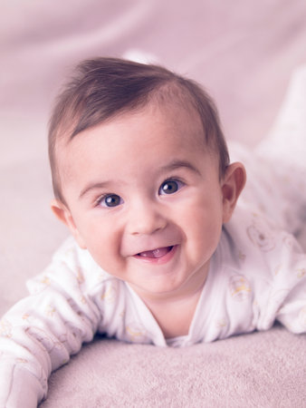Portrait of giggling baby boy.