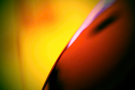 The shape of the guitar on the light gold backgroundの写真素材