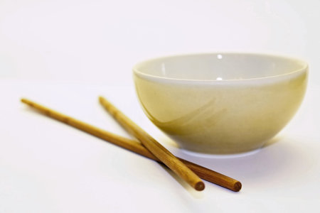 Chinese chopsticks with small dishの写真素材