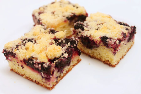 Three pieces of blueberry pie on white plate