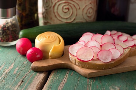 Picture of bread slice with butter and cut radishes. の写真素材