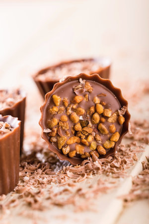 Vertical photo of few brown chocolate cupcakesの写真素材